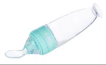 Biberon cuillère silicone 1er âge, idéal pour l'alimentation bébé facile et propre.